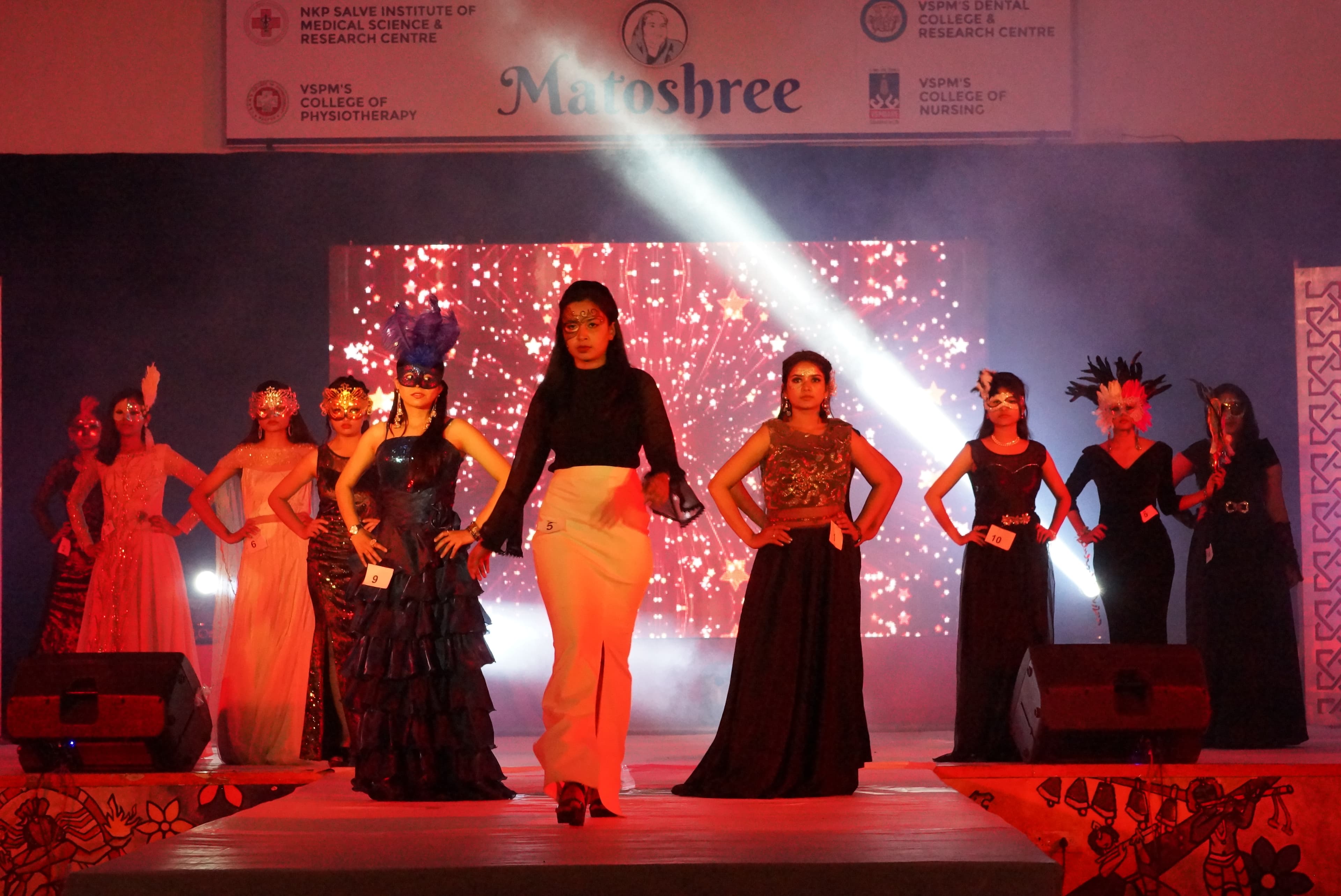 Students performing together on stage during an annual campus gathering